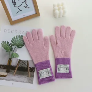 Pink and purple color-blocked knit winter gloves for women, cozy and warm detailed view.