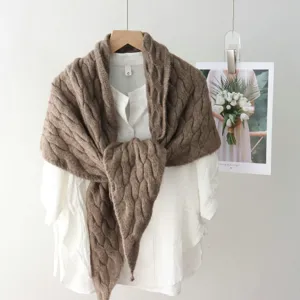Cable knit triangle shawl scarf closeup, cozy winter warm textured wear detail display.