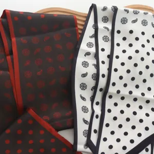 Elegant long silk scarf featuring classic dot and geometric prints, versatile accessory for suits and shirts.