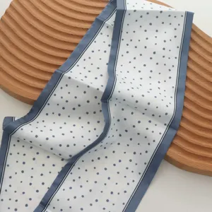 Elegant blue and white polka dot hair ribbon scarf for stylish everyday styling looks.