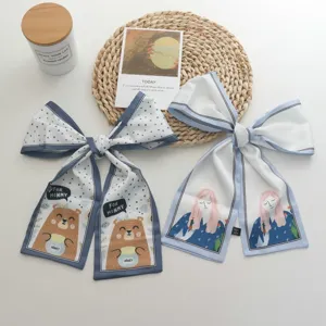 French silk scarf hair bow cute hair tie ribbon detailed view showing bear and girl print design