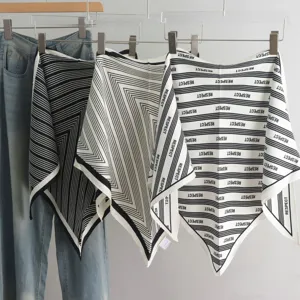 Detailed view of fashionable black and white geometric pattern triangle scarves for women and office wear.