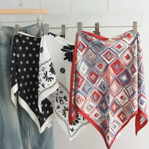Stylish printed silk square scarves with geometric and floral patterns, styled fashion accessories.