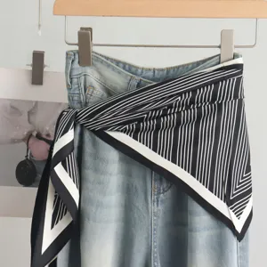 Elegant black and white striped silk scarf for women, classic fashion neckwear accessory.