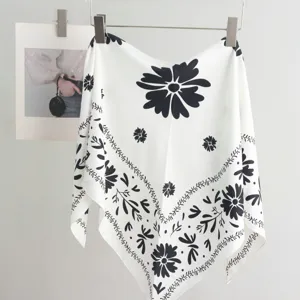 Black and white floral print triangle scarf detail, elegant silk-like waist accessory for women.