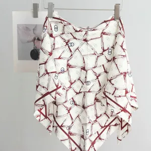 Elegant imitation silk triangular scarf with geometric print and stylish design for women.
