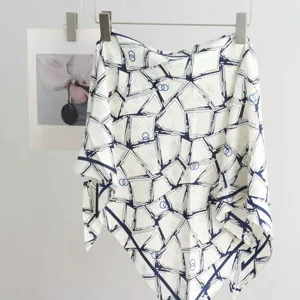 Chic imitation silk triangle scarf featuring a stylish blue geometric pattern for women.