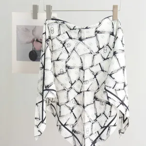 Elegant black and white geometric printed imitation silk triangular scarf, chic accessory.