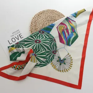 European style printed silk twill square scarf with elegant geometric lantern patterns and red border.
