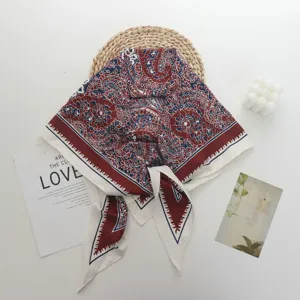 Detailed view of luxury vintage paisley print imitation silk square scarf and neckerchief.