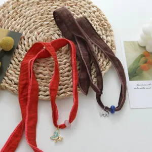 Chic fabric ribbon choker and bracelet set featuring delicate butterfly and elephant charms.
