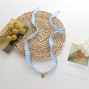 Dopamine light blue silk scarf ribbon choker bracelet with cute evil eye pendant and bead.