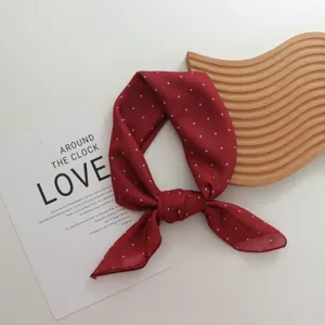 Red polka dot cotton square scarf detail view, elegant women neckerchief and head wrap.