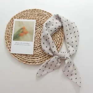 Detail view of vintage geometric triangle print scarf, soft fabric neck scarf for women.