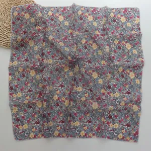 Detail view of a floral print cotton linen small square scarf, soft vintage floral bandana.