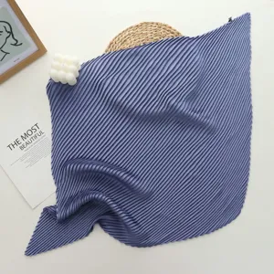 Detailed view of the purple pleated square scarf, soft imitation silk fabric and fine texture.