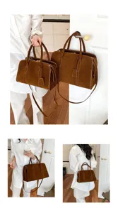 Retro brown suede Boston bag detail view, showing handle, zipper and shoulder strap wear.