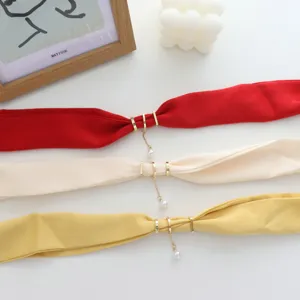 Detailed view of summer thin solid color neckerchief with stylish magnetic buckle and pearl chain.