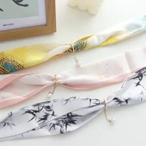 Elegant long silk scarf with pearl pendant and magnetic buckle, perfect for spring and summer.