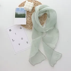 Elegant light green linen long scarf ribbon detail, minimalist daily neck wrap style.