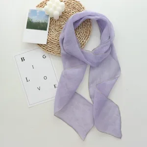 Detailed view of elegant light purple long ribbon scarf, lightweight solid color neck wrap.