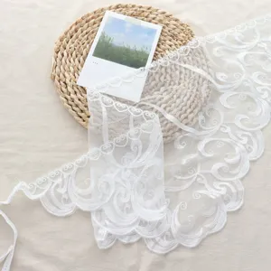 White lace trim triangular headscarf, delicate floral embroidery, sweet layering accessory.