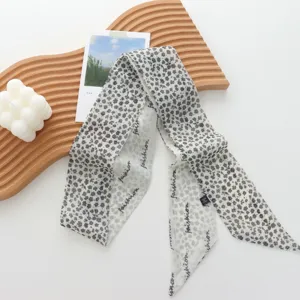 Chic floral skinny scarf for women, versatile long ribbon scarf for neck hair bag accessory.