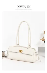 Elegant white quilted shoulder bag with long handles and stylish golden ring clasp closure.