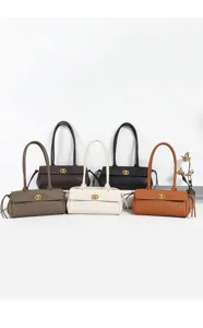 Classic quilted baguette shoulder bag with long handle and metal lock. Stylish daily handbag.
