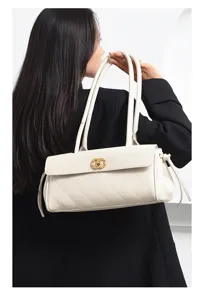 Elegant white quilted shoulder bag with double straps and luxury style gold hardware for women.