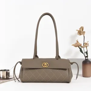 Vintage quilted shoulder bag for women, long handle tote bag with elegant golden lock clasp.