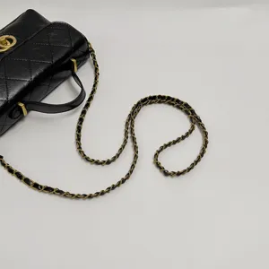 Black quilted leather chain handbag featuring gold hardware and elegant classic flap design details.