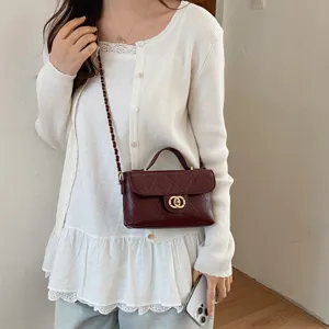 Burgundy quilted crossbody bag with gold chain strap, elegant women shoulder handbag.