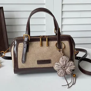 Retro color-blocked Boston bag for women, stylish suede handbag and shoulder messenger bag.