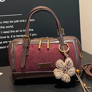 Retro color-blocking Boston bag for women, stylish niche handbag and crossbody shoulder bag.
