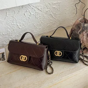 Chic quilted chain crossbody bag for women, stylish top handle small square handbag.