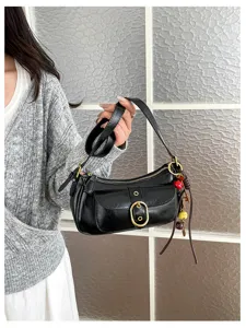 Retro black shoulder bag for women, chic metal buckle handbag, casual daily underarm bag detail.