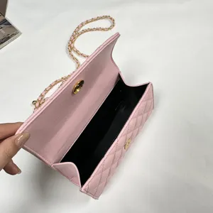 Pink quilted chain shoulder bag, stylish flap crossbody bag for women daily fashion wear.