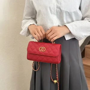 Red quilted chain shoulder bag detail showing classic flap design and gold hardware.