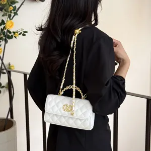 Elegant white quilted leather shoulder bag with gold chain strap for women fashion style.