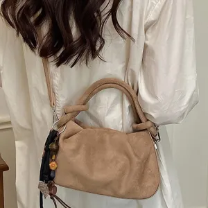Retro Maillard suede shoulder dumpling bag for women, stylish pleated underarm handbag.