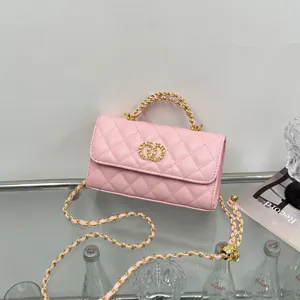 Pink quilted chain shoulder bag for women, elegant luxury style crossbody handbag with metal handle.