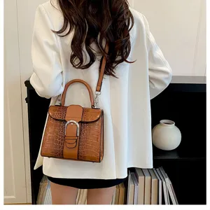 Detailed shot of retro crocodile pattern handbag, stylish contrast color shoulder bag for women.