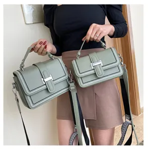 Trendy green leather crossbody bag for women with chic metal lock and wide strap fashion.