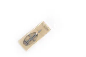 Detailed view of retro embroidery scissors with vintage handle design in packaging.