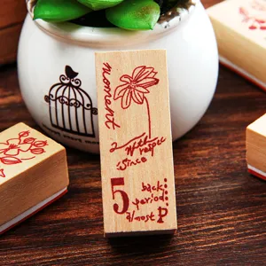 Vintage wooden stamp with floral and English text design, ideal for DIY scrapbooking craft.