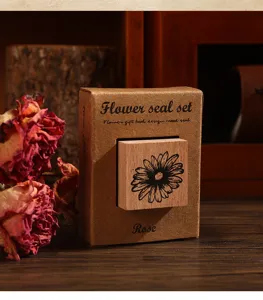 Vintage wooden stamp set with floral design in craft box for journaling and craft DIY.