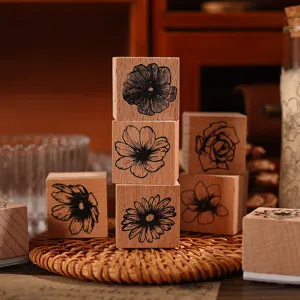 Vintage wooden rubber stamps set with floral botanical patterns for journaling and DIY crafts.