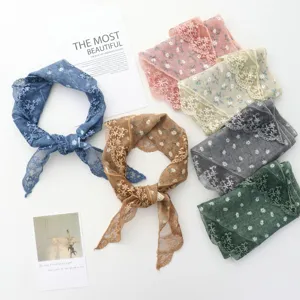 Close-up detail of Japanese retro floral lace triangle scarf, exquisite embroidered edge.