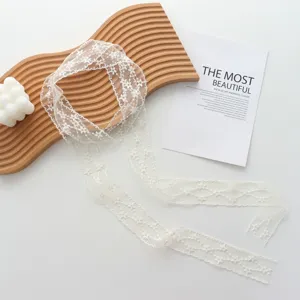 White floral lace ribbon necklace detail shot, delicate embroidery choker for women and girls.